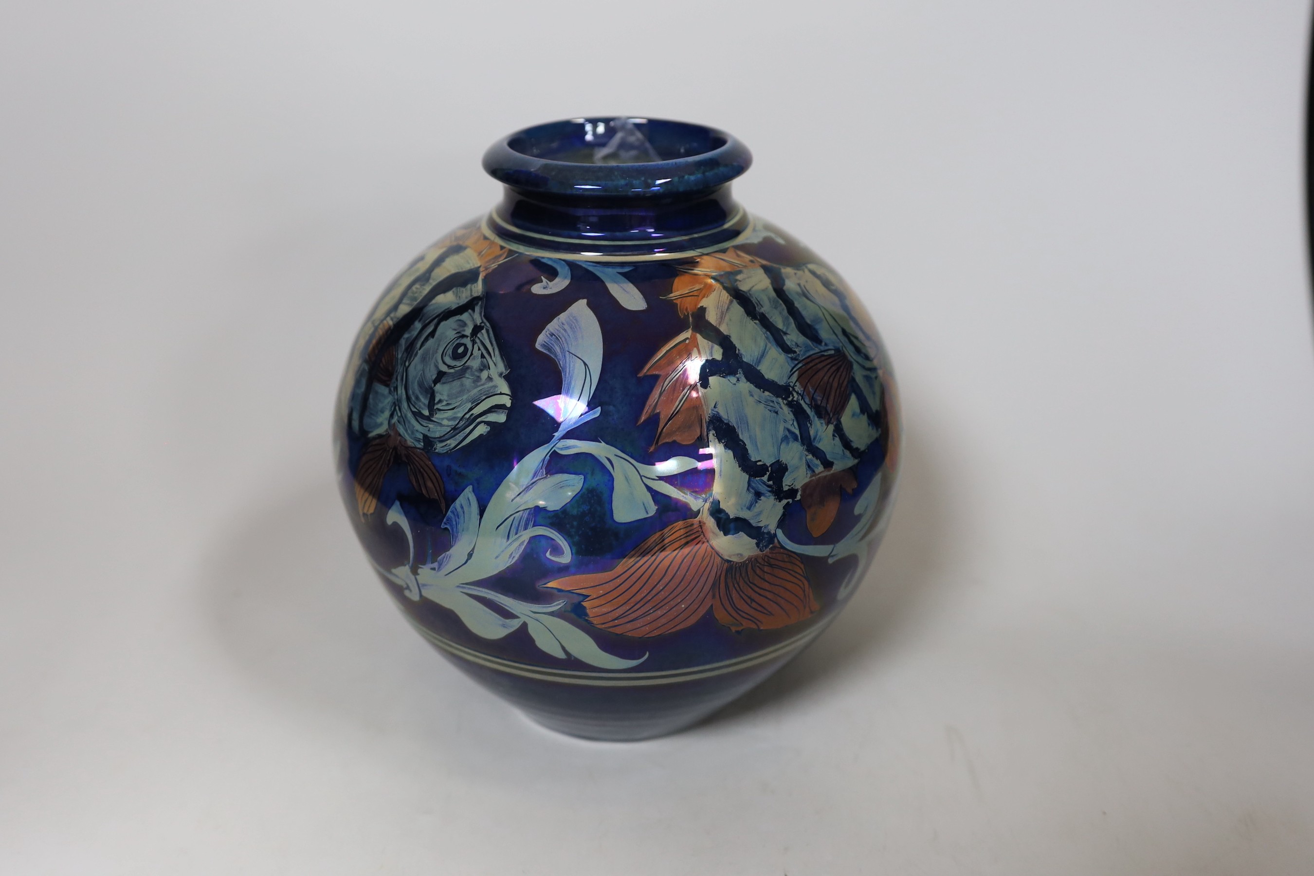 A Chiswell Jones art pottery lustre vase, decorated with three fish, No 8596, 21cm